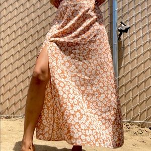 Peach colored floral skirt with slit